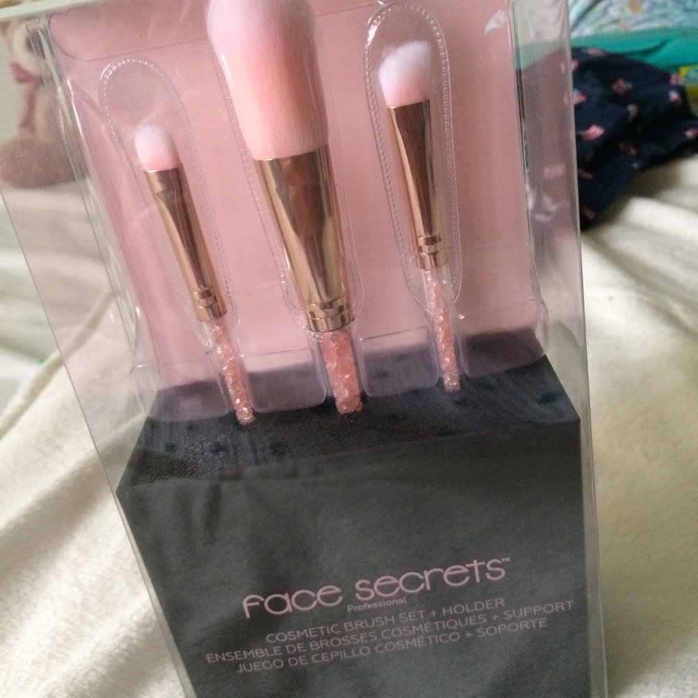 Make up brushes and a make up brush holder.